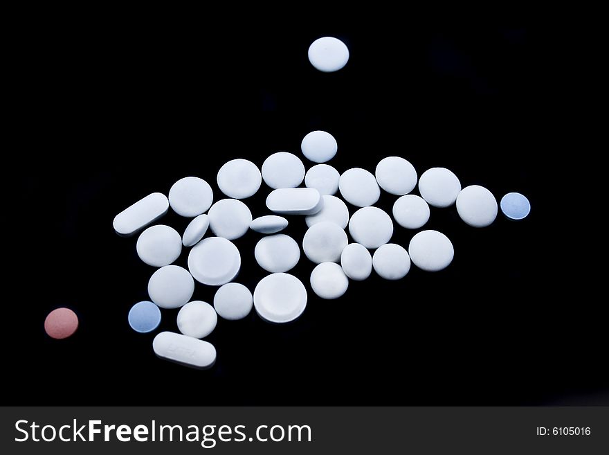 Tablets on a black background