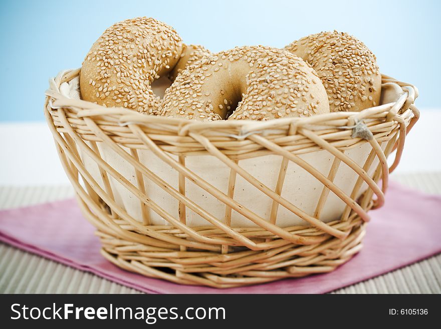 Breakfast bagels on the kitchen table over blue background