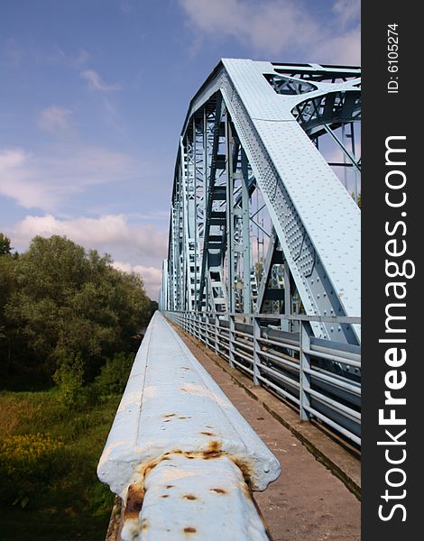 Blue bridge over river in Poland
