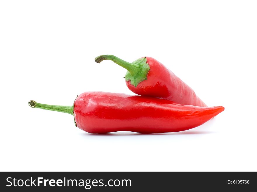 Pair of red hot peppers isolated on the white background