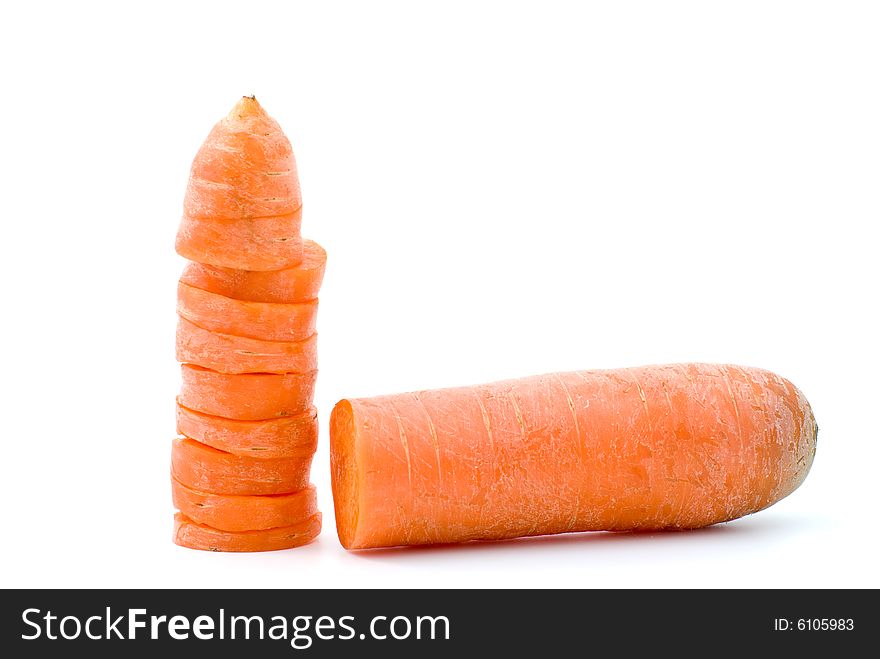Half of carrot and few slices isolated on the white background
