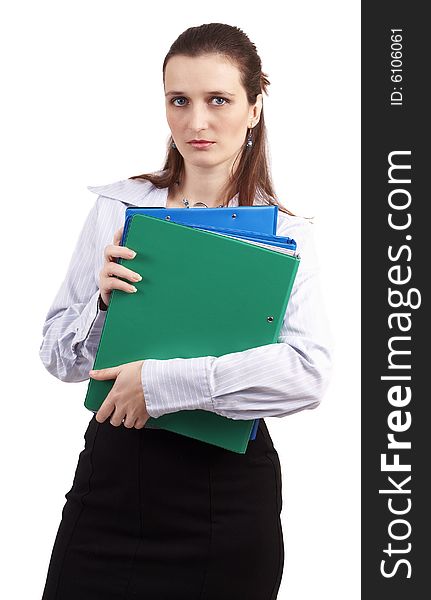 Beautiful brunette businesswoman wearing a blue shirt and a skirt, holding files and folders. Isolated on white background with copy space