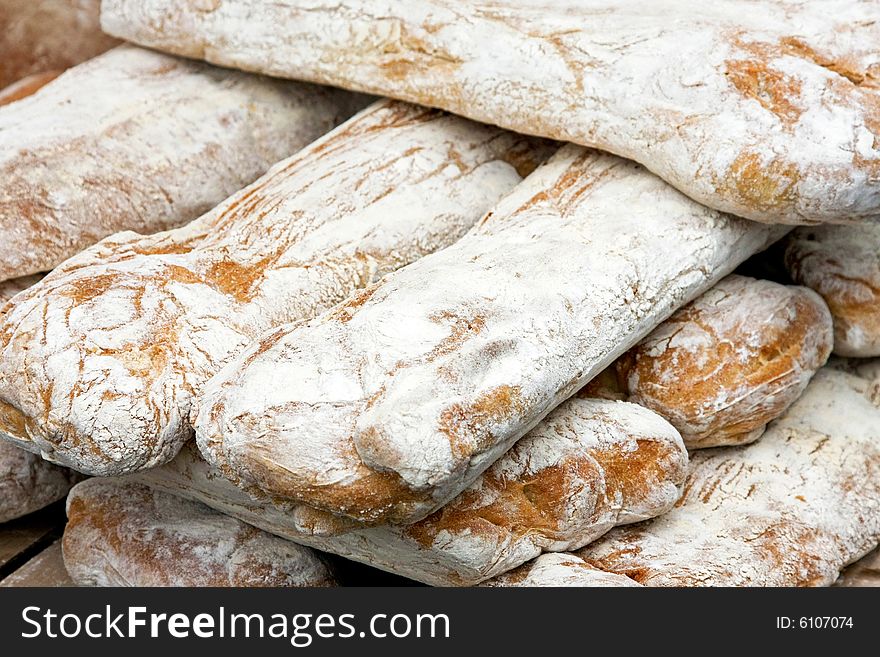 Bunch of white bread sticks on the market