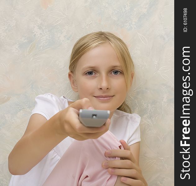 Teenager girl with remote control