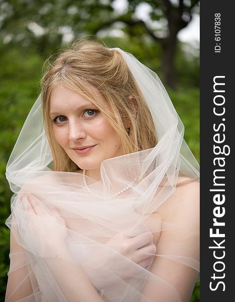 Bride with her veil wrapped around her