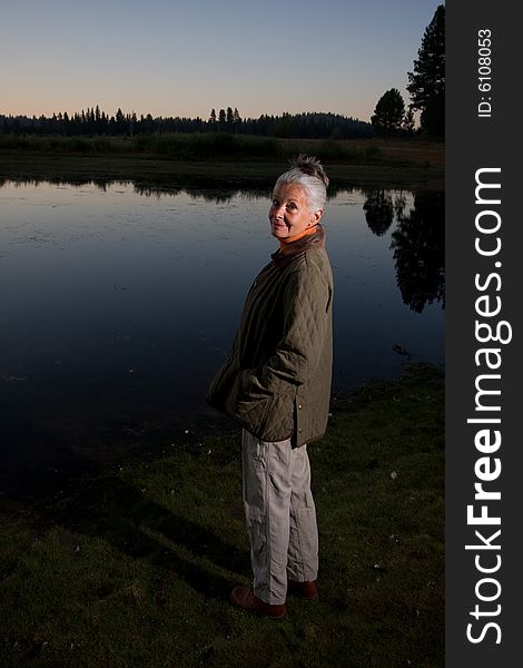 Senior woman looking at lake. Senior woman looking at lake