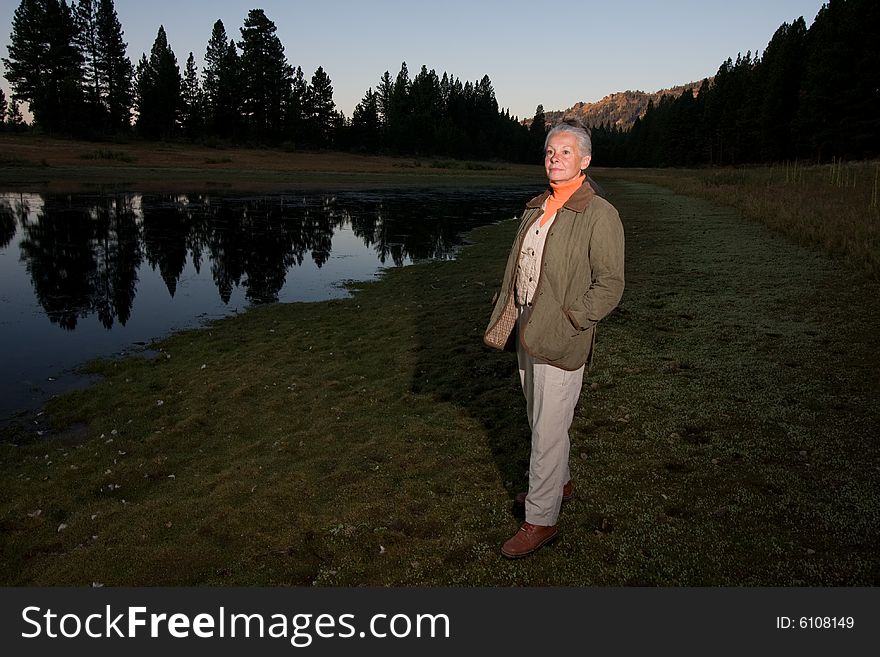 Senior woman looking at lake. Senior woman looking at lake