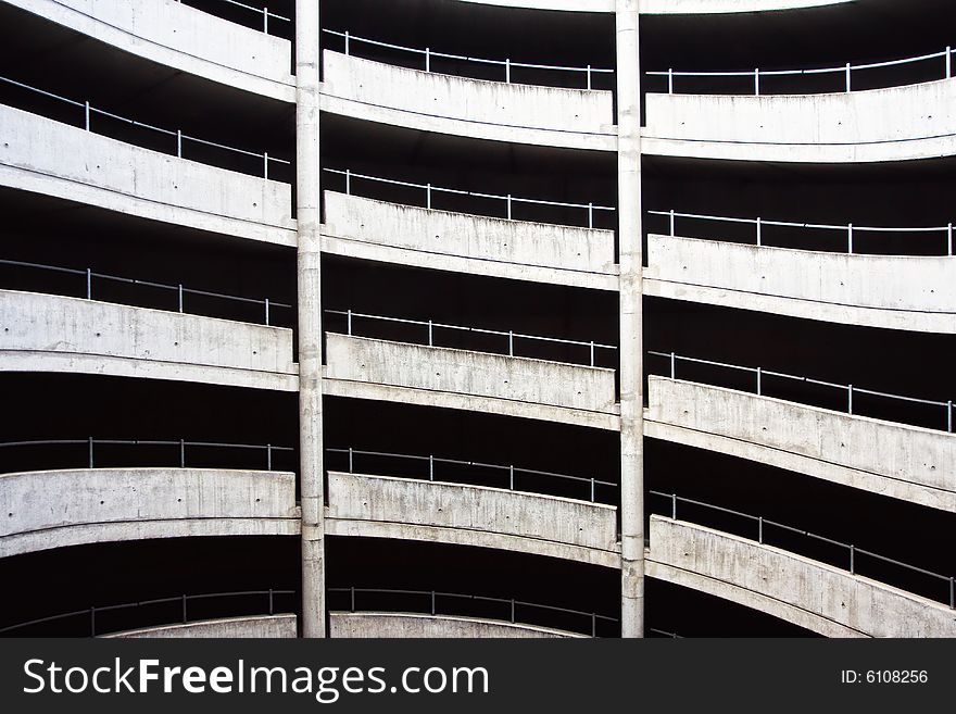 A dirty car park (parking lot) exit spiral.