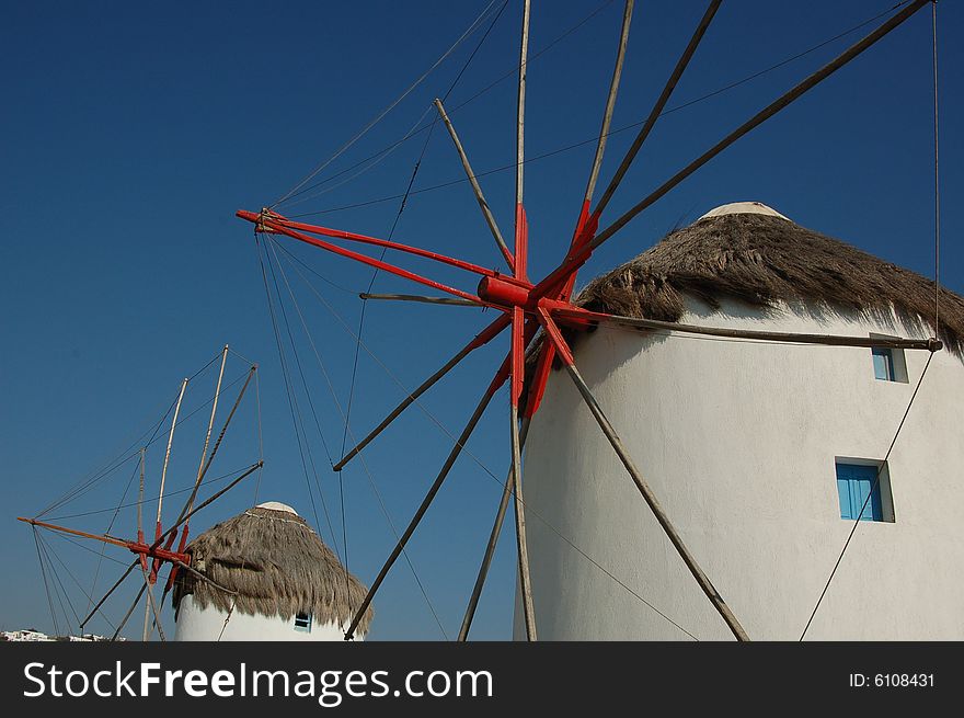 An image of the iconic windmills in Mykonos, Greece.