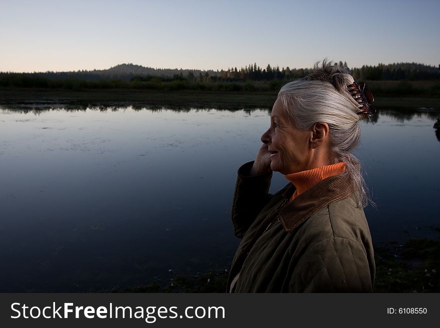 Senior woman looking at lake. Senior woman looking at lake