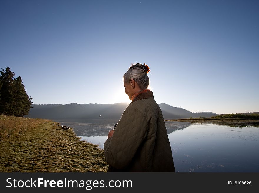 Senior woman looking at lake. Senior woman looking at lake