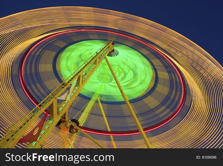 Carnival Ferris Wheel spinning fast