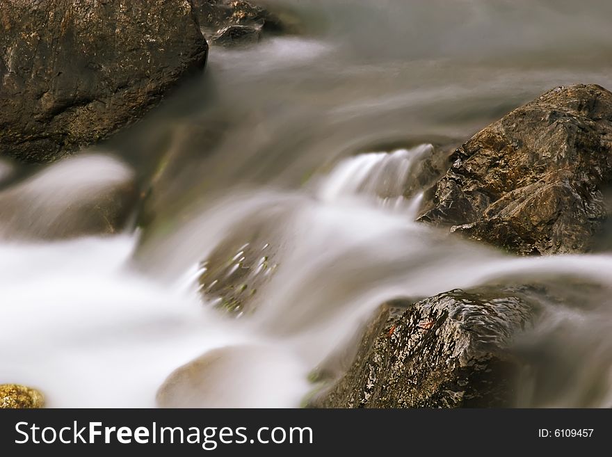 Water flowing smoothly over rocks. Water flowing smoothly over rocks