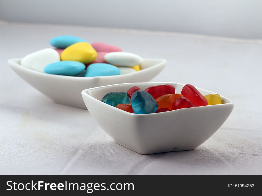 Sweets of different kinds in white bowls