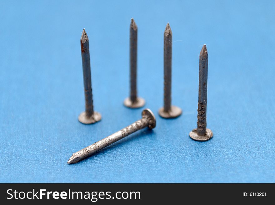 Isolated nails on blue background