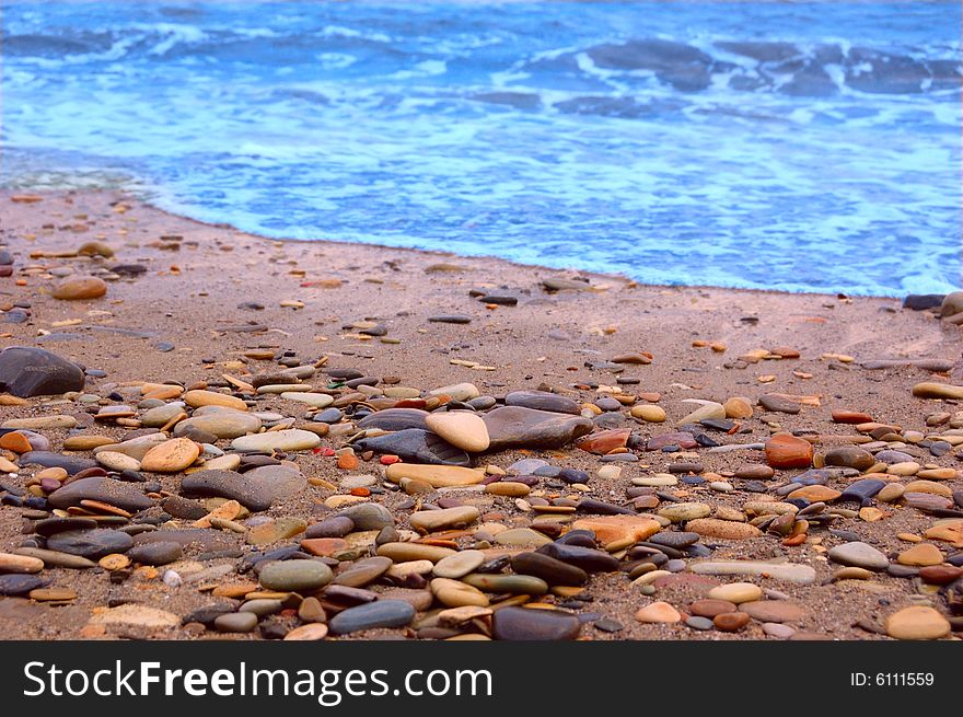 Closeup of sea shore covered with pebbles. Closeup of sea shore covered with pebbles