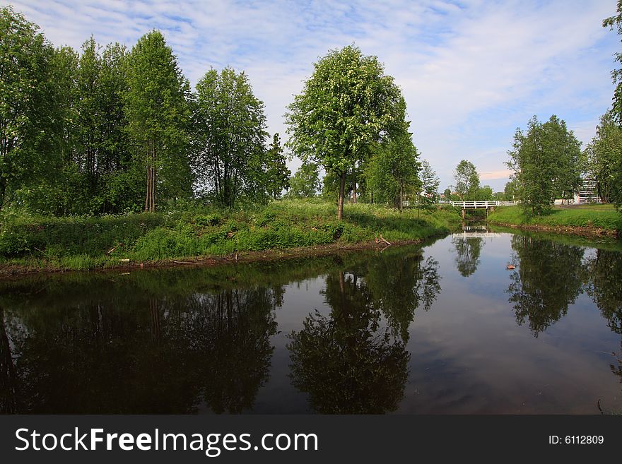 Trees reflecting in the water of a lake, Finland