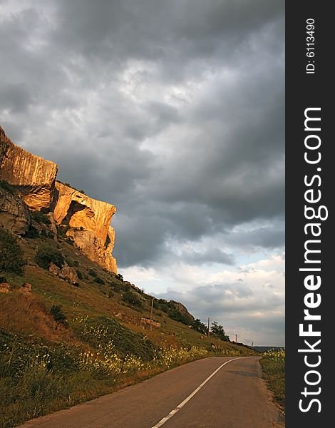 Beautiful cliff in sunset light with overcast sky on the background. Natural Light.