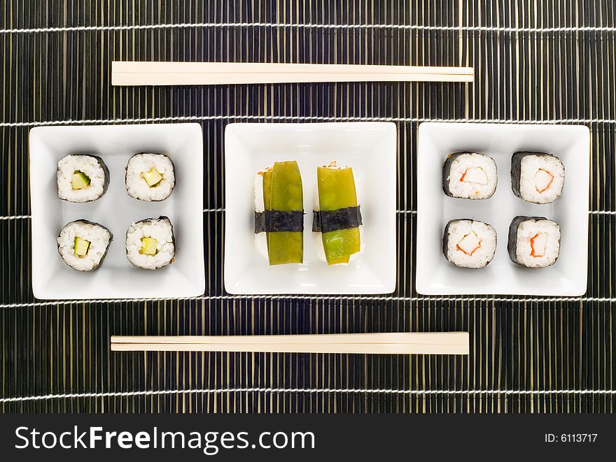 Three plates with different kinds of sushi