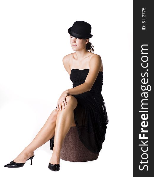 Young woman wearing a little black dress and old fashion bowler hat. Young woman wearing a little black dress and old fashion bowler hat