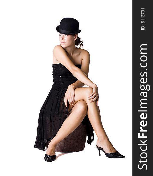 Young woman wearing a little black dress and old fashion bowler hat. Young woman wearing a little black dress and old fashion bowler hat