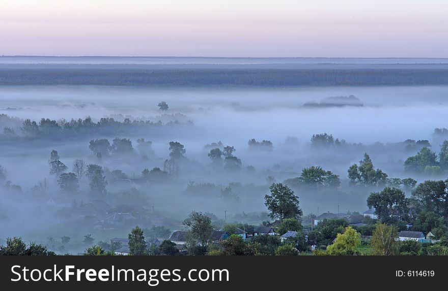 Village on a background of a fog
