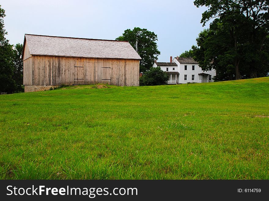 This is a shot of an old farmhouse with a new barn This is one happy farmer. The foundation is an original foundation from the old barn.