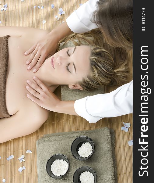 Woman in a day spa getting a deep tissue massage therapy