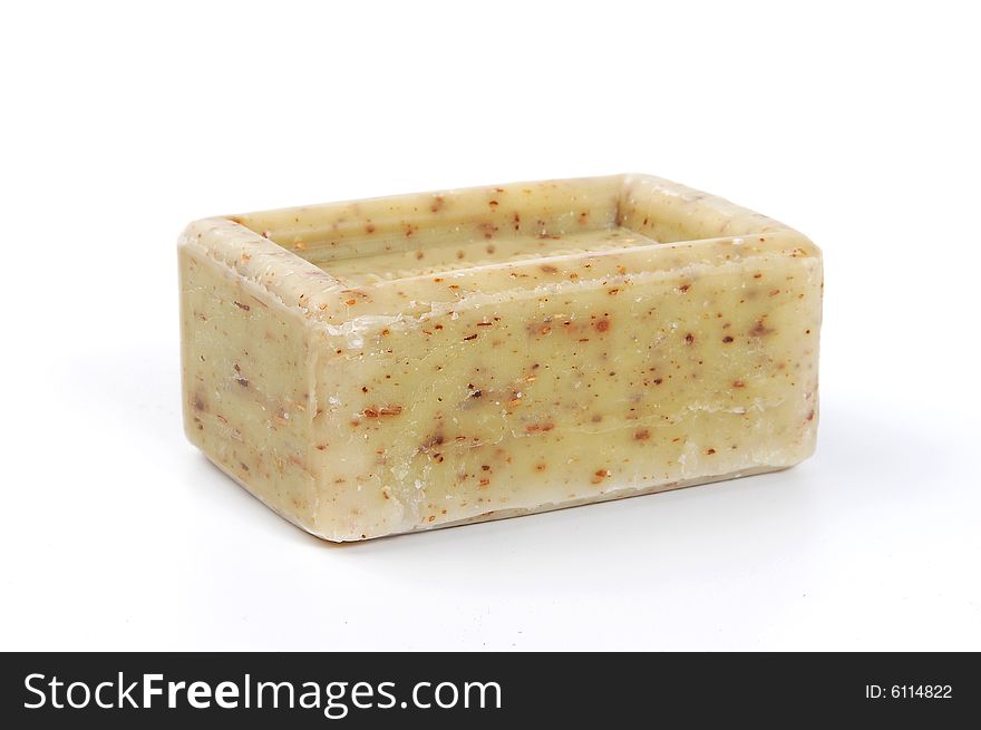 A piece of olive soap, isolated on white. A piece of olive soap, isolated on white.