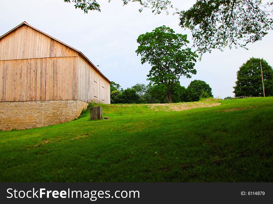 This is a shot of an old farmhouse with a new barn This is one happy farmer. The foundation is an original foundation from the old barn.