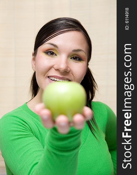 Attractive brunette woman with apple. Attractive brunette woman with apple