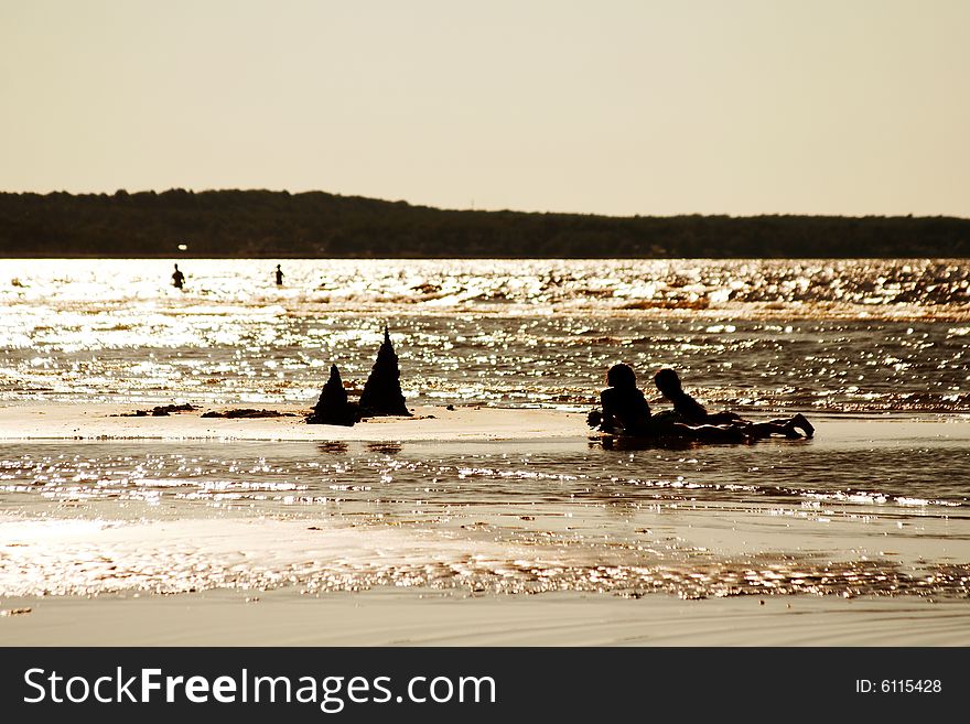 Children Playing On A Beach