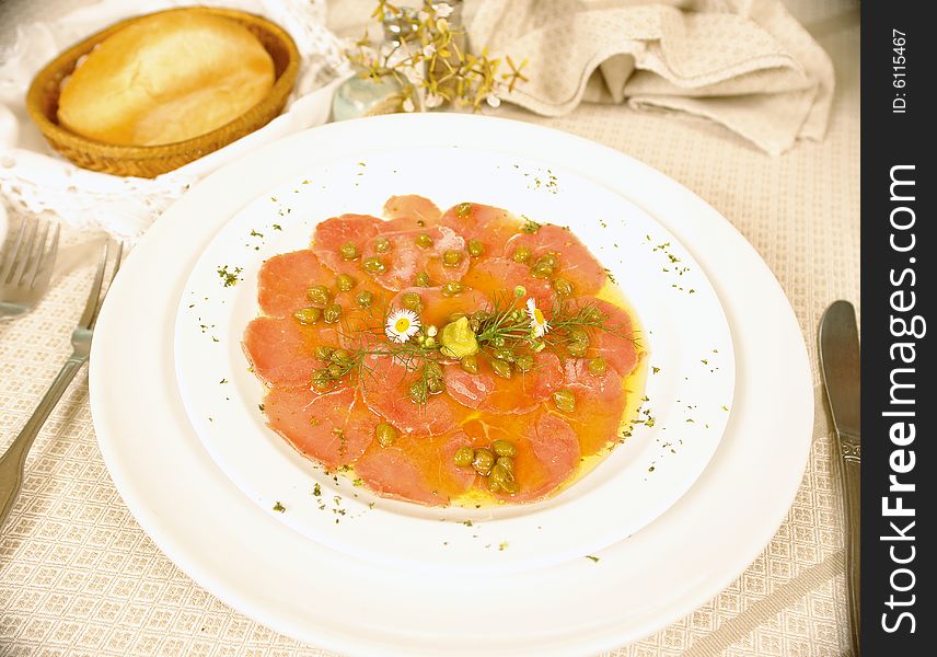 Beef carpaccio with capers and lemon