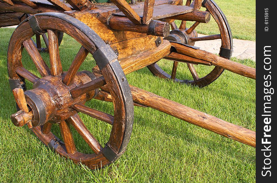 The old wooden cart on the field. The old wooden cart on the field