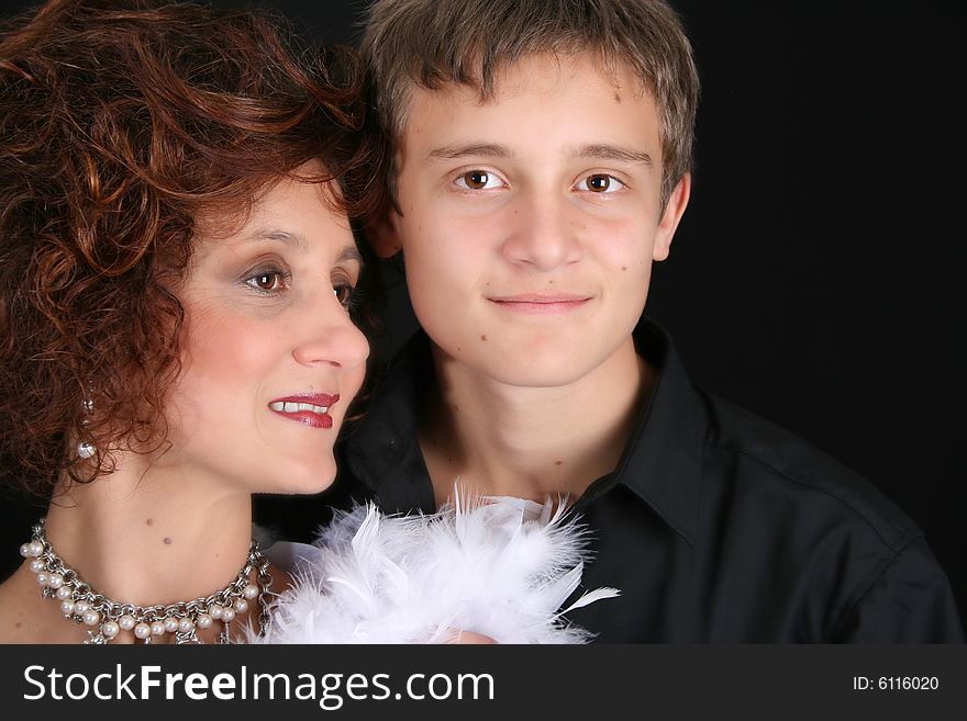 Rich and stylish mother and son in formal attire