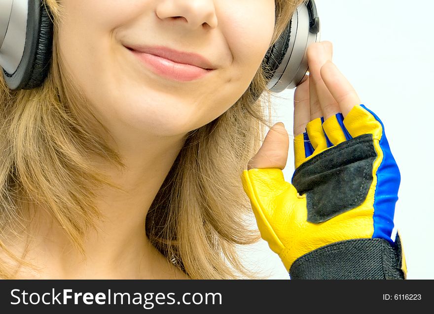 Smiling girl with headphones and music