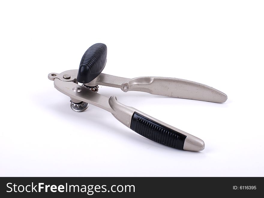 Tin can opener isolated on a white studio background. Tin can opener isolated on a white studio background