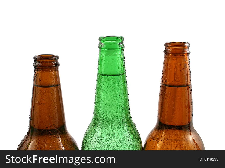 Three bottles of fresh cold water close up isolated