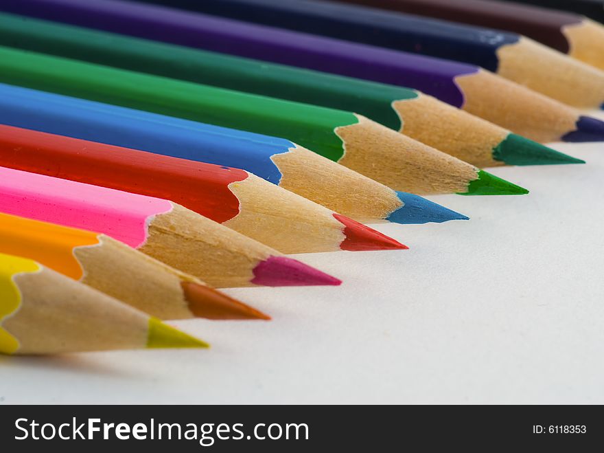 Closeup of colored crayons on white background