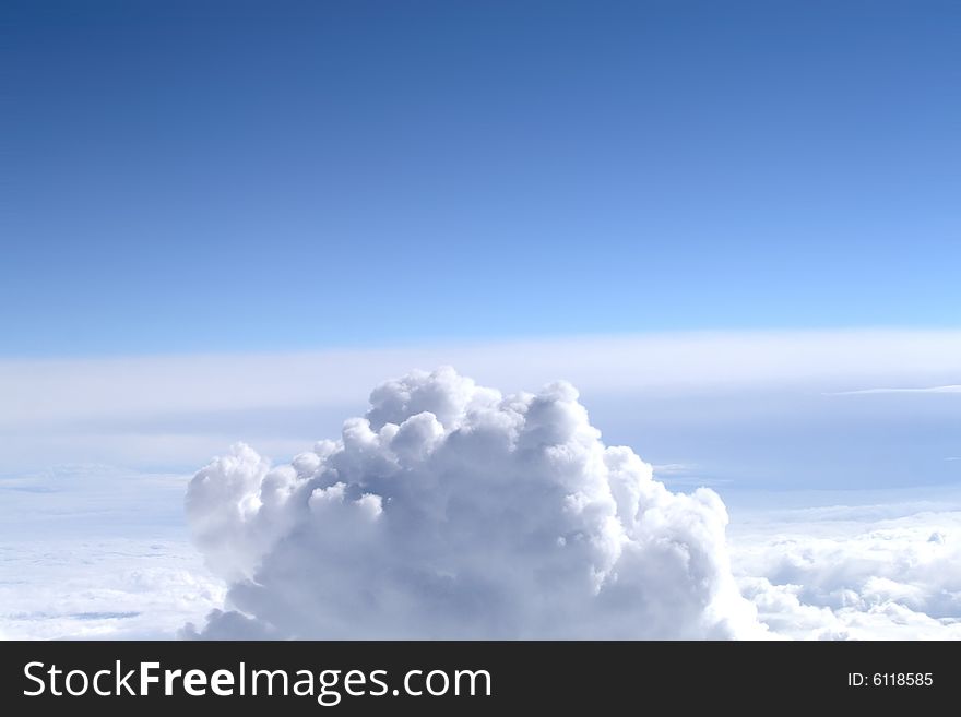 Background of blue sky with white cumulus clouds