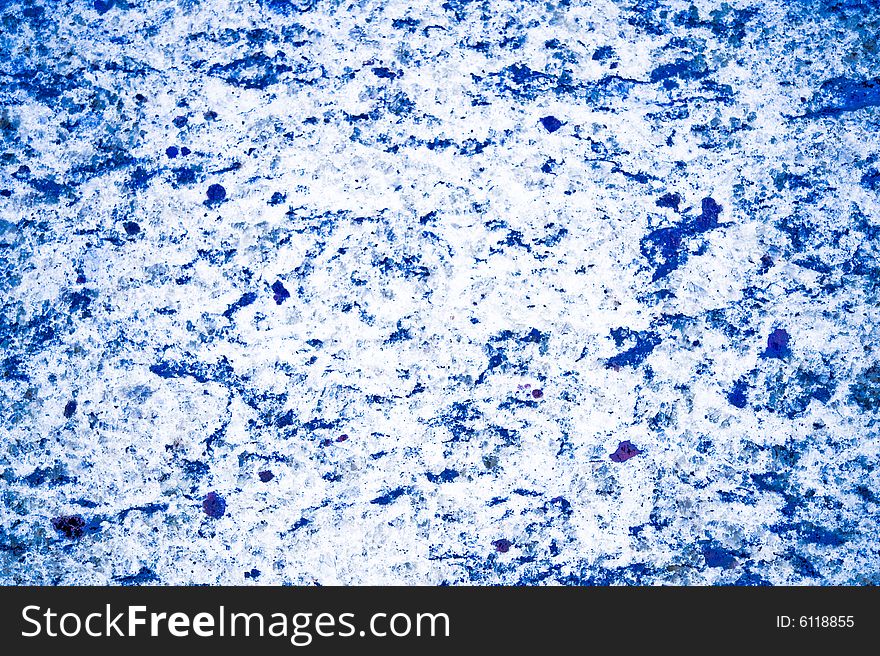 An abstract image of ice- colored granite. An abstract image of ice- colored granite