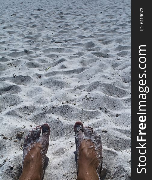 Feet in the varm sand