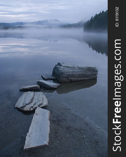 Morning mist over mysterious lake