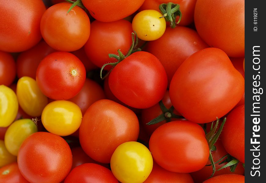 Red and yellow tomatoes in detail