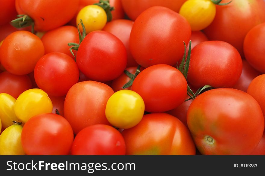 Red and yellow tomatoes in detail