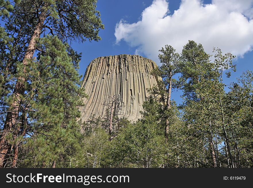 View of Devils Tower, Wyoming from the Northwest via the walking trail that circumnavigates the mountain. View of Devils Tower, Wyoming from the Northwest via the walking trail that circumnavigates the mountain.