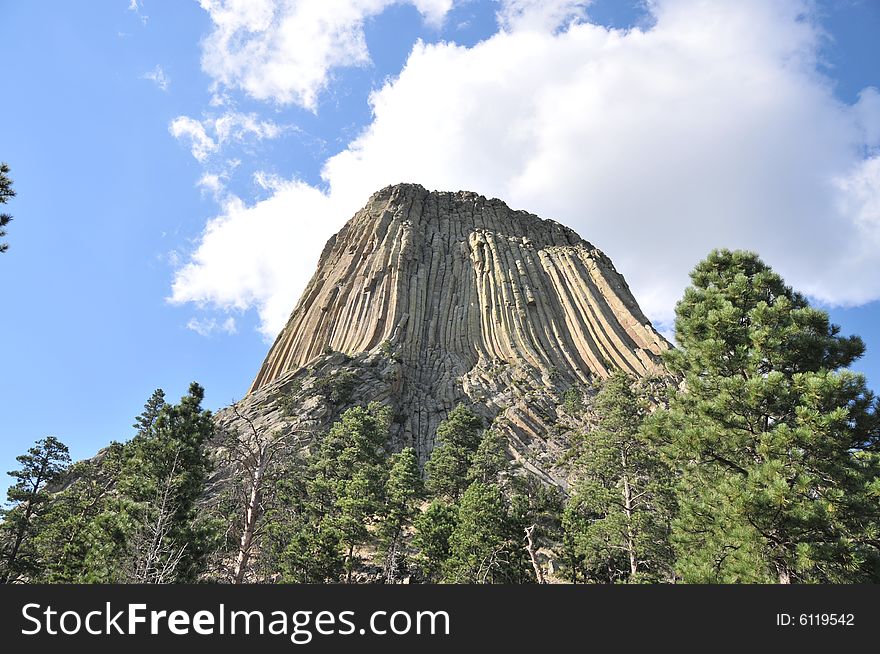 Devils tower from the southeast via the walking path that skirts the boulder field below. Devils tower from the southeast via the walking path that skirts the boulder field below.