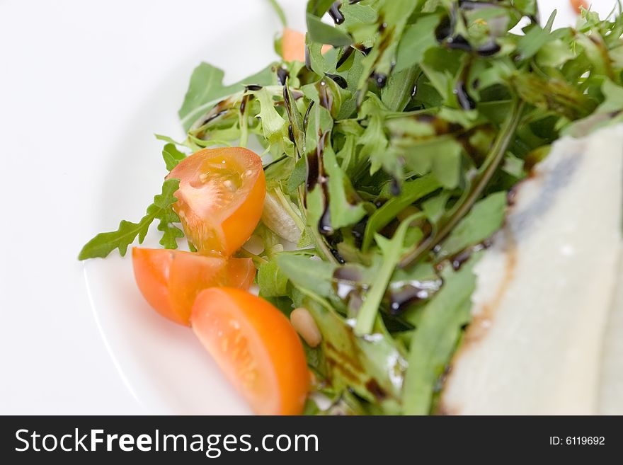 Refined food from a restaurant on a white plate. Refined food from a restaurant on a white plate