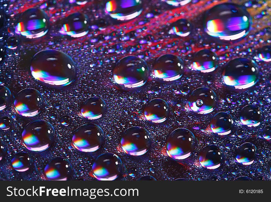 Abstract colorfull water drops on cd surface, shallow DOF