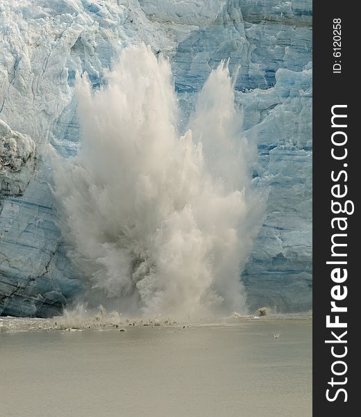 Chunk of ice broken off the glacier makes a splash. Chunk of ice broken off the glacier makes a splash